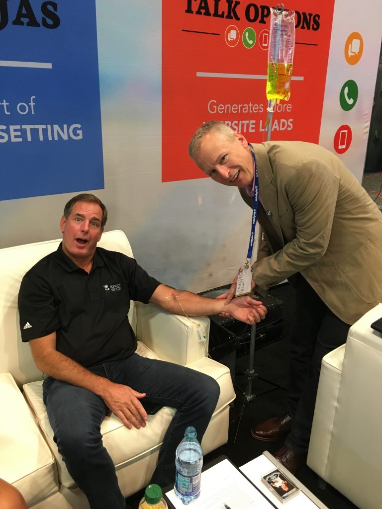 Helping Jerry Thibeau rehydrate in the Vegas heat